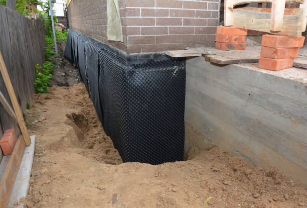 Happy homeowners after waterproofing job in Kingsford Heights